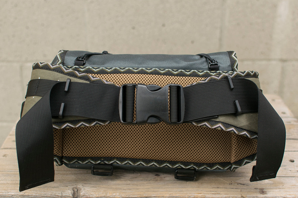 Back view of grey Big Dumpling hip pack with Eastern Rattler colored trim tape.