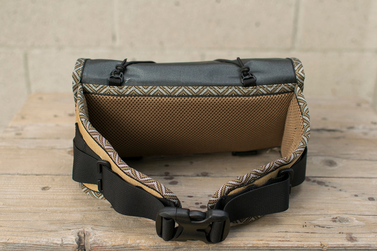 Back view of grey Little Dumpling hip pack with Great Horned Owl trim tape.