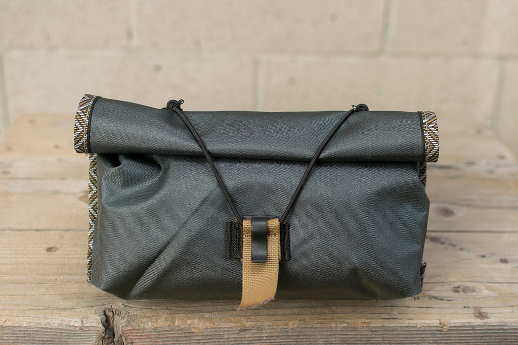 Front view of grey Little Dumpling hip pack with Great Horned Owl trim tape.