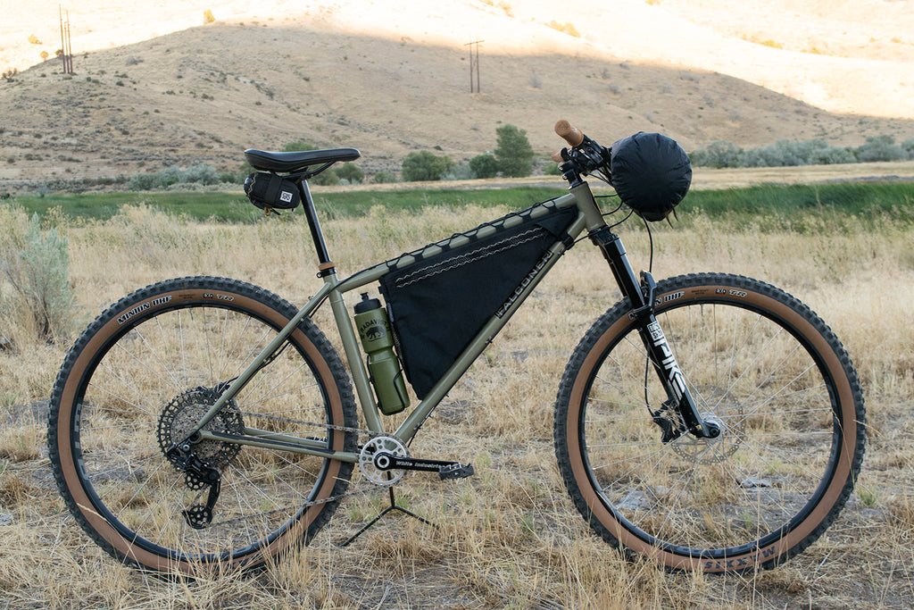 Wedge custom frame bag in black, fitted above the bottle cage