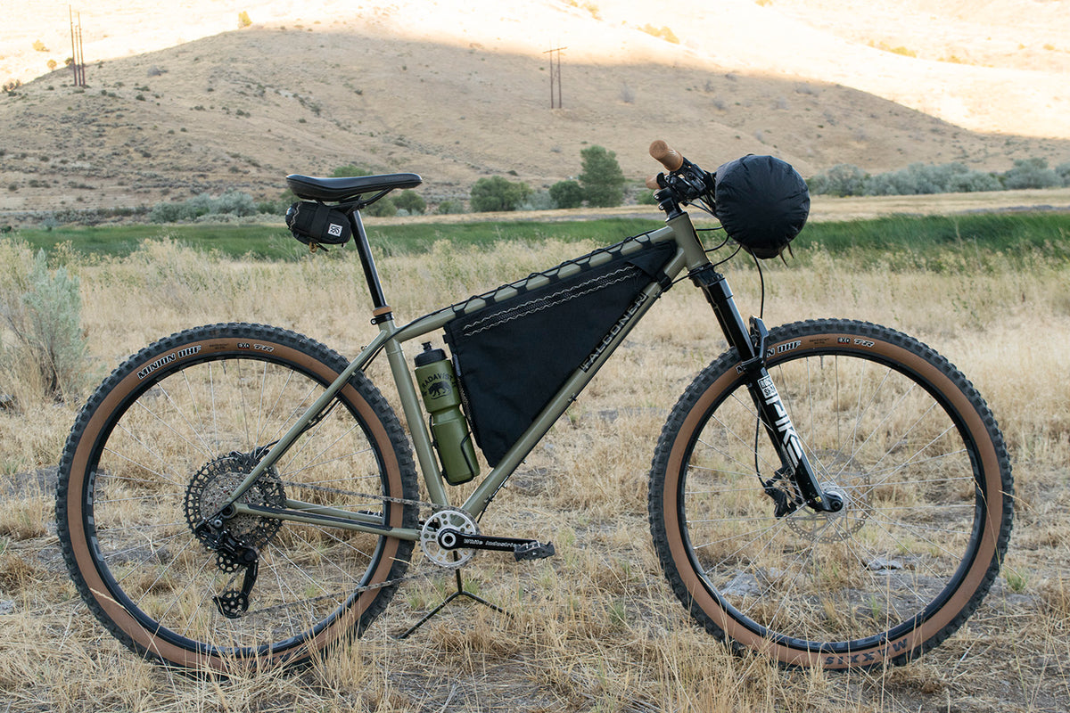 Wedge custom frame bag in black, fitted above the bottle cage