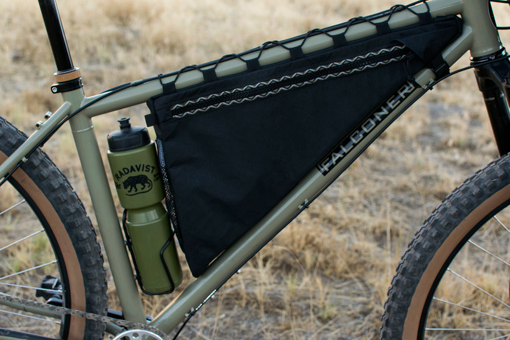 Wedge frame bag detail: zipper, trim tape, top tube lace up and bottle clearance