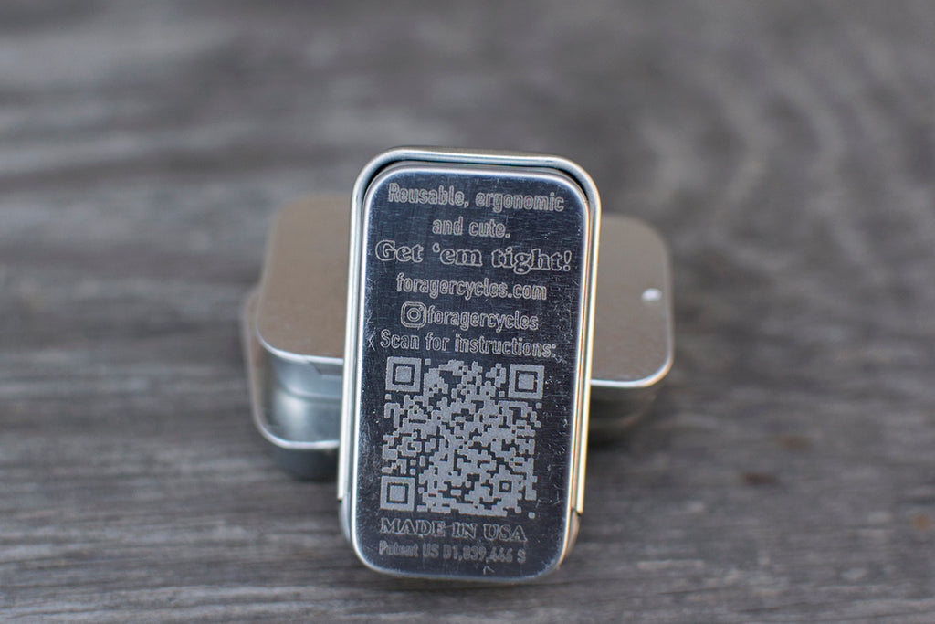 Back of the tin engraved with a QR code linking to fitting instructions.
